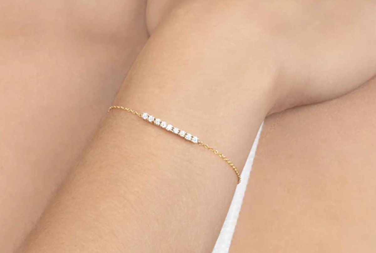 Goud plated armband met ingelegde steentjes